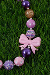 PURPLE TONE BUBBLE GUM BEAD NECKLACE W/BOW SIDE PENDANT .